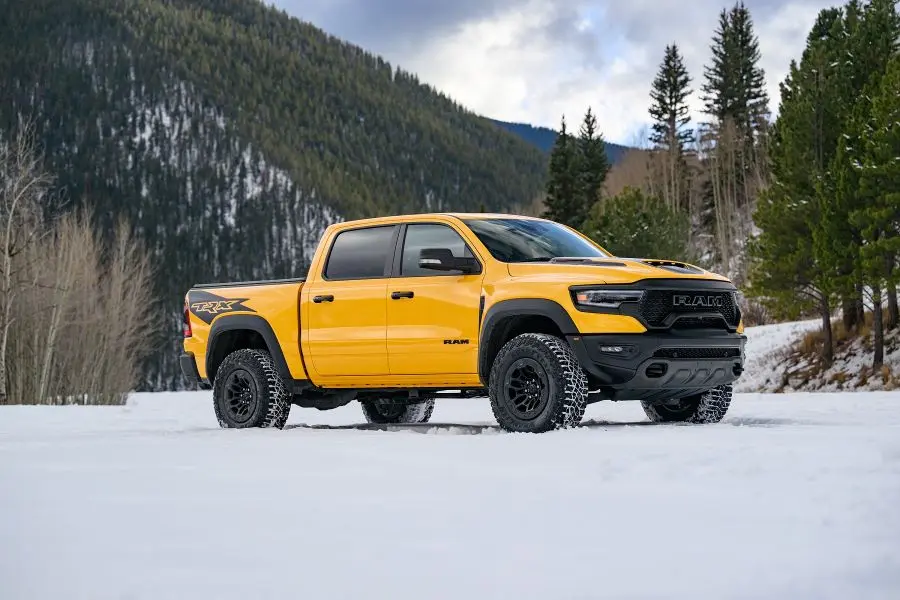 A yellow 2024 Ram 1500 full-size truck.