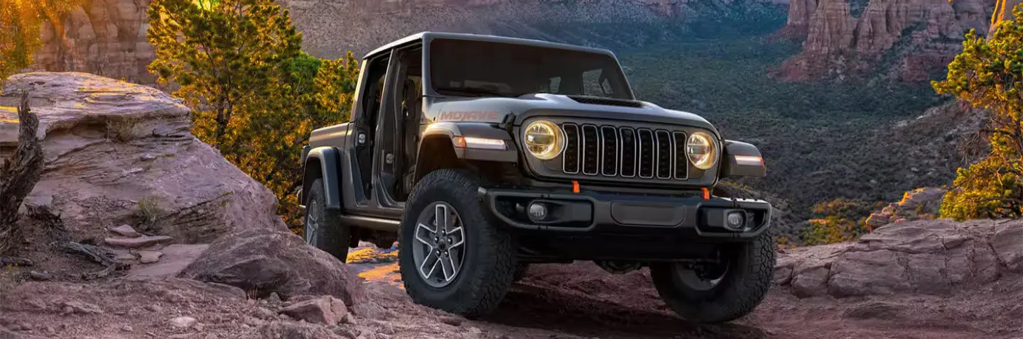 jeep gladiator mojave driving up a rocky slope