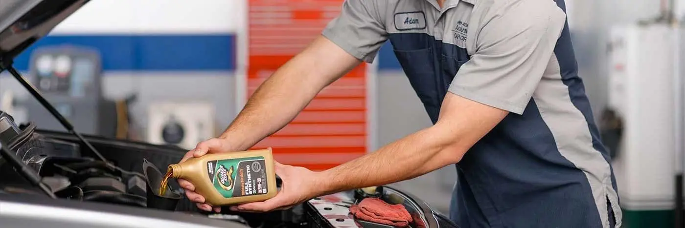 Hyundai mechanic doing an oil change