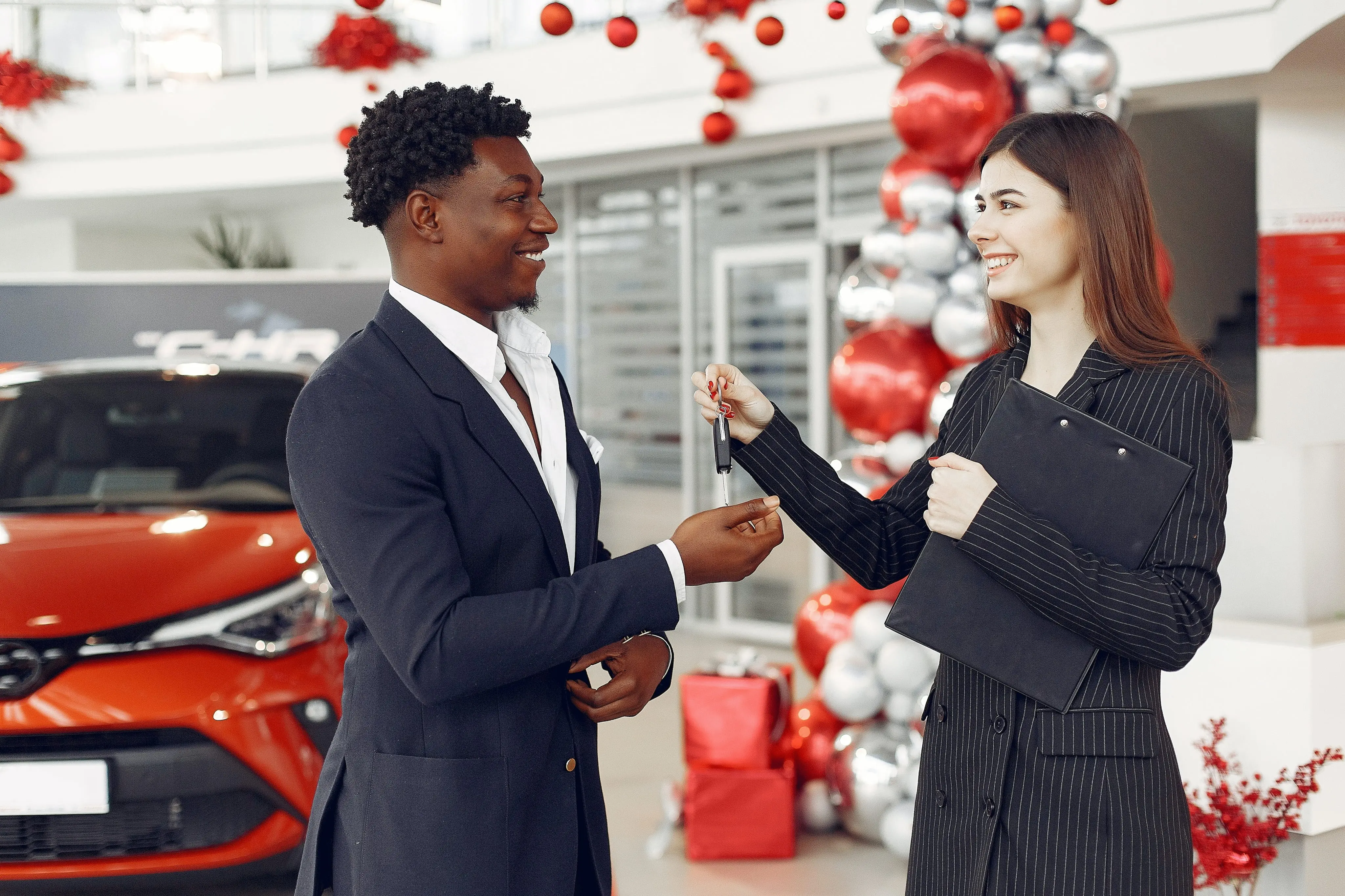 Women handing the key to the custiomer