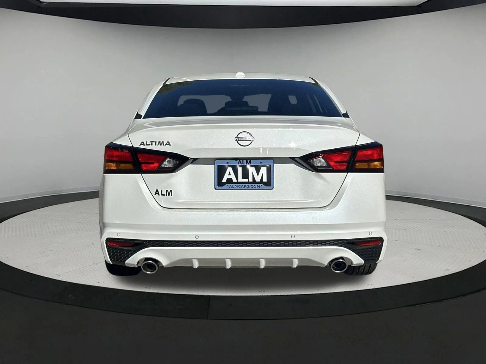 Rear view of a white 2026 Nissan Altima at ALM Nissan Newnan