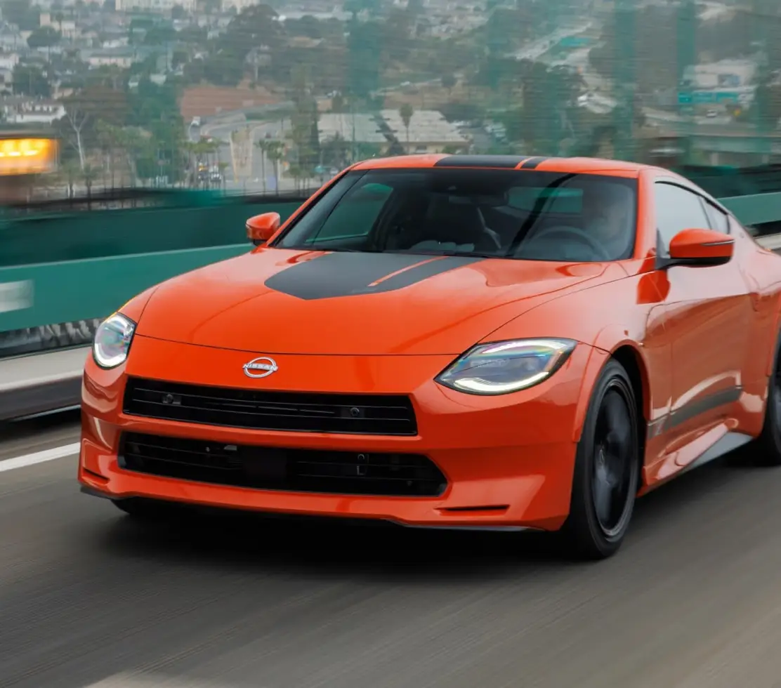 Orange Nissan Z Heritage Edition driving on the highway