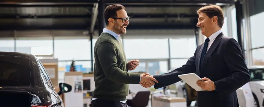 Customer discussing vehicle financing with a dealership representative