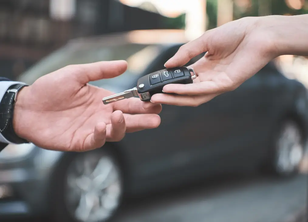 Car key handoff for key replacement and duplication services at Autos of Chicago