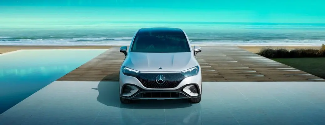 A Mercedes in a driveway near the ocean.