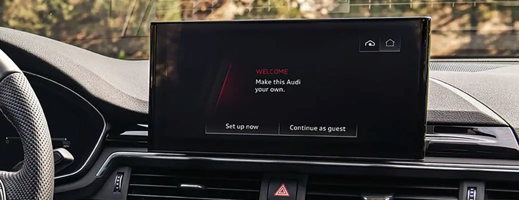 A person connecting to the Audi A4 MMI infotainment system.