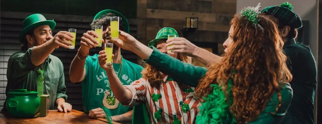 People celebrating St. Patrick's Day in an Irish pub near Dallas.