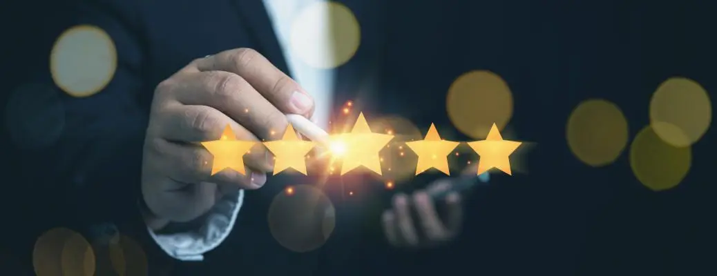 Customer satisfaction concept. Businessman touching five glowing golden stars for customer services excellence. Evaluation survey after client use product and service.