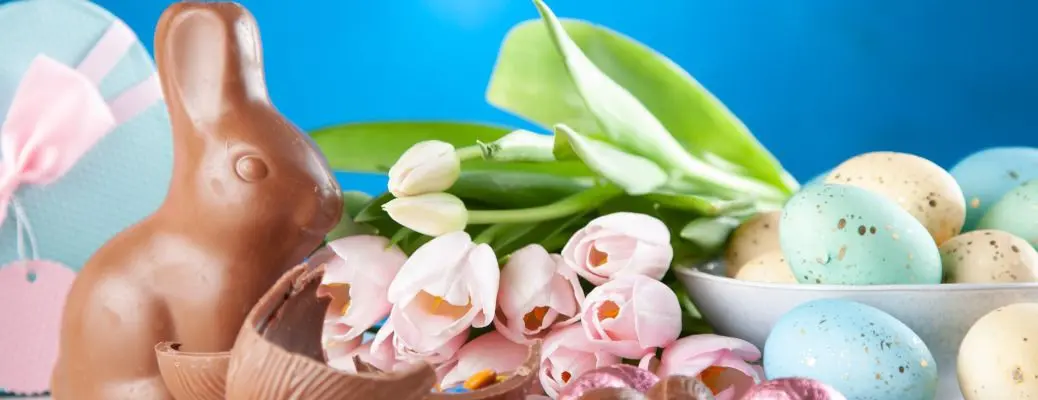 An Easter image with eggs and chocolate bunny.