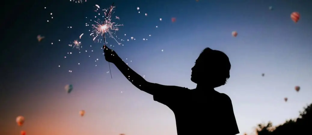 A person holding a sparkler.