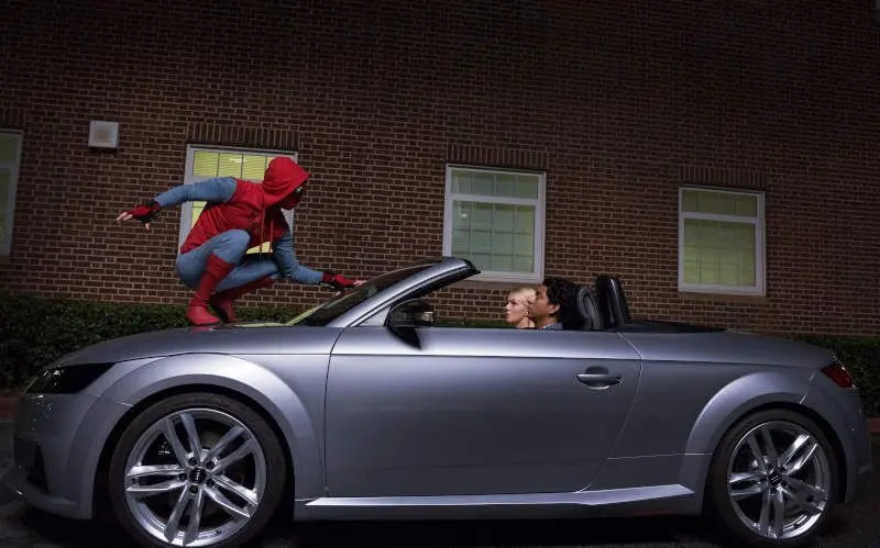 Spider-Man on top of an Audi model
