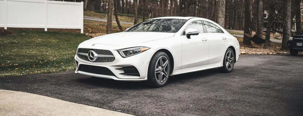 A Mercedes Benz delivered to a driveway.