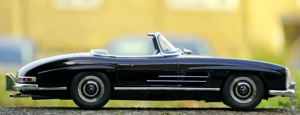 The exterior of a classic convertible Mercedes.