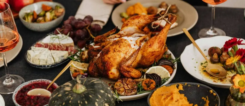 A table loaded with Thanksgiving dinner.