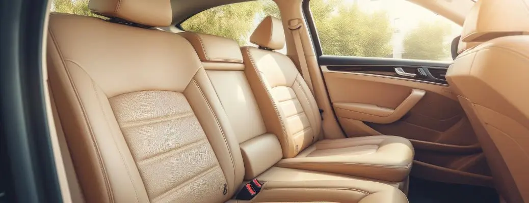 Back seat: wide, clean; leather interior, car passenger and driver seats, angle view, sunroof, buttons, dashboard, beige nappa leather.