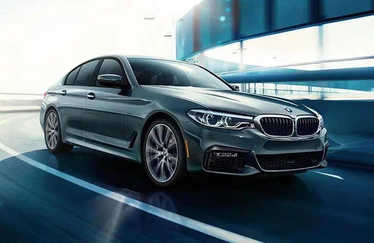 2019 BMW 5 Series driving on a road