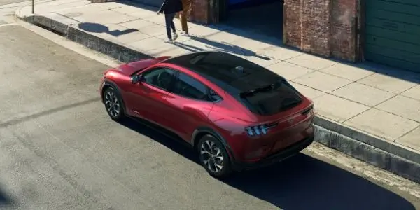 Red 2021 Ford Mustang Mach-E Rear Exterior on a City Street