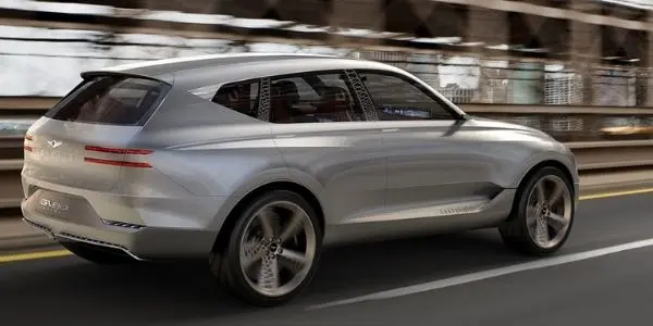 Silver 2021 Genesis GV80 Rear Exterior on City Street