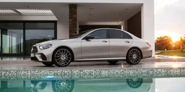 Bronze 2021 Mercedes-Benz E-Class Sedan Side Exterior Next to House