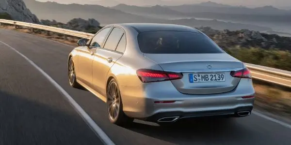 Bronze 2021 Mercedes-Benz E-Class Rear Exterior on a Coast Road