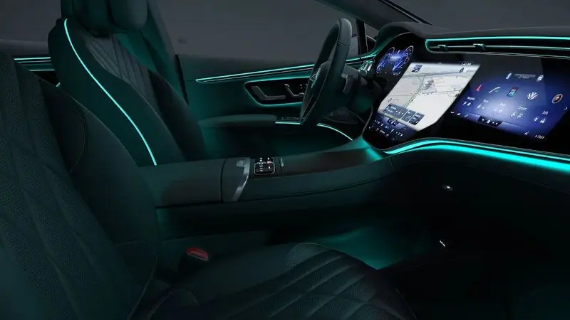 A richly done interior with a huge infotainment system.