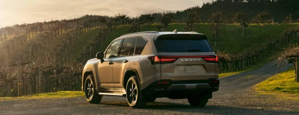 A rear quarter external view of the all-new 2025 Lexus LX 700, a hybrid SUV.