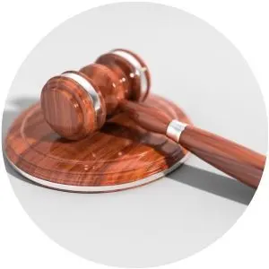 Close Up of a Judge's Gavel on a Gray Background