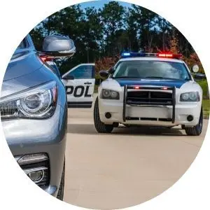 Gray Car Pulled Over with Police Car Behind