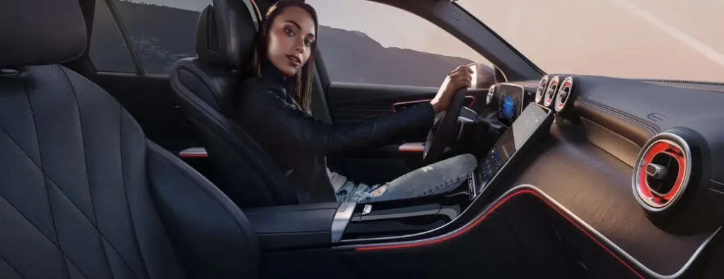 A woman sitting in the cockpit of the 2025 Mercedes-Benz GLC 300.