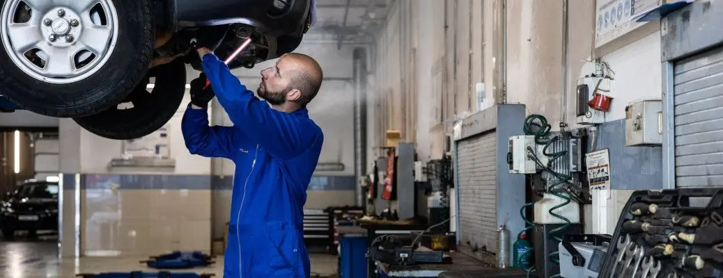 A man servicing a car.