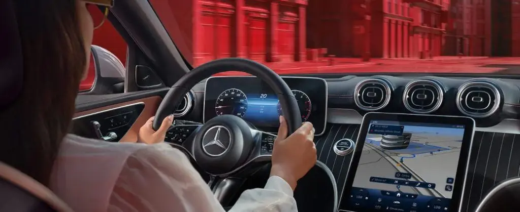 The luxurious, high-tech interior of the Mercedes C-Class sedan.