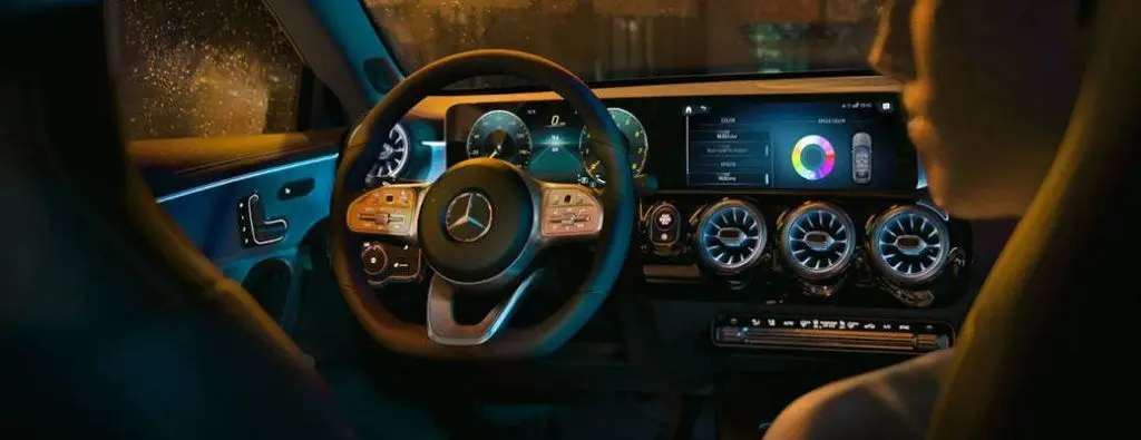 The cockpit of a Mercedes Benz CLA class car, which is one of the Pre-owned Luxury Car Under $15k near Dallas buyers can find at Autos of Dallas.