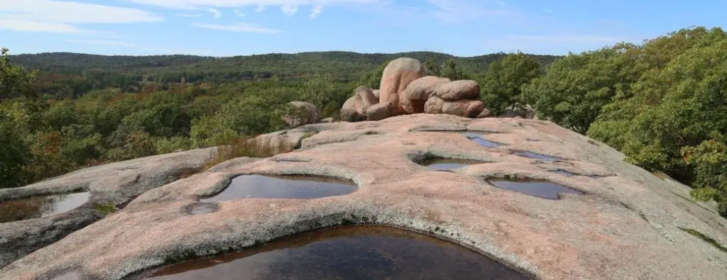 Top 3 State Parks near Dallas include fun places with forests and rock formations like this.