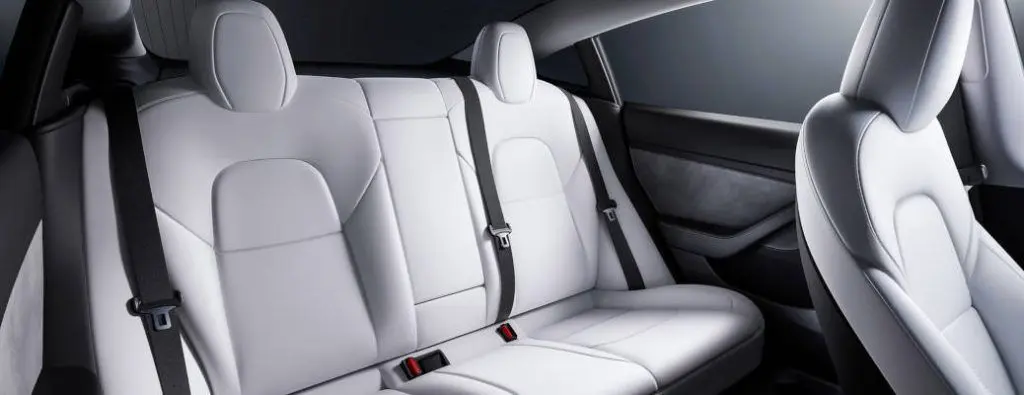 The high-quality interior of the Tesla Model 3, one of the EV models available for sale at Autos of Dallas.