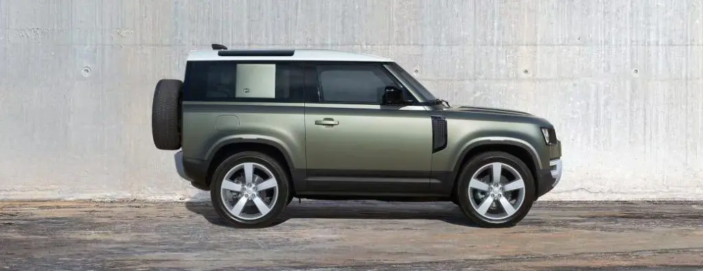 A side view of the 2023 Land Rover Defender 110, which has excellent off-road capabilities.