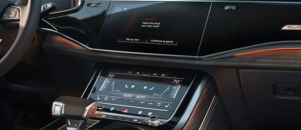 Audi Q8 tech features include these dual touchscreens with haptic feedback.