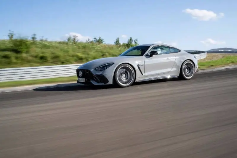 A side exterior view of the AMG GT 63 PRO 4MATIC+ on the race track.