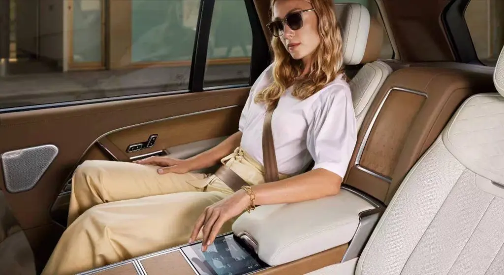 A woman enjoying the luxury features in a Range Rover.