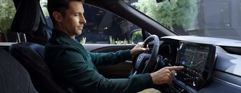 A man driving a pre-owned vehicle with Adaptive Cruise Control near Dallas.