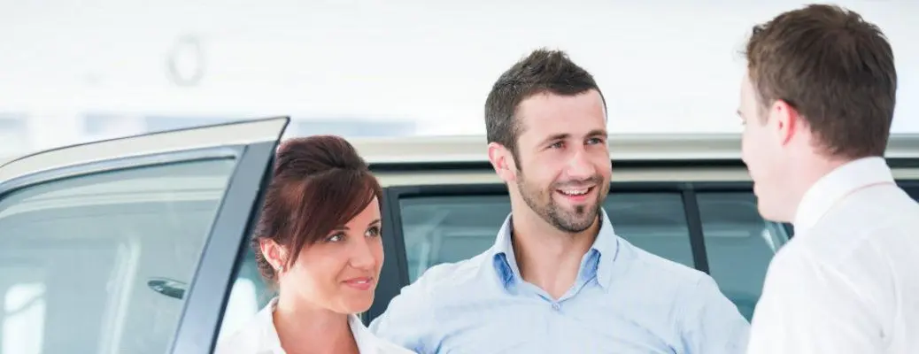 People selling a car.