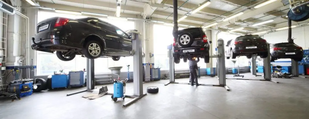Cars up on lifts at one of the best service shops in Dallas.
