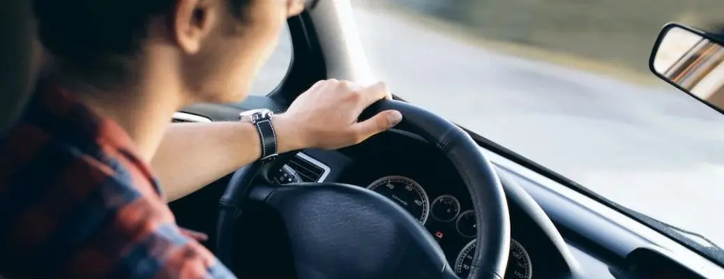 A teen driving carefully.