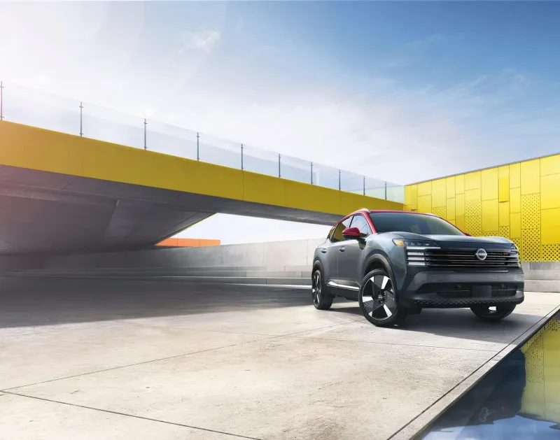 Nissan SUV parked in a modern urban setting with bold architecture