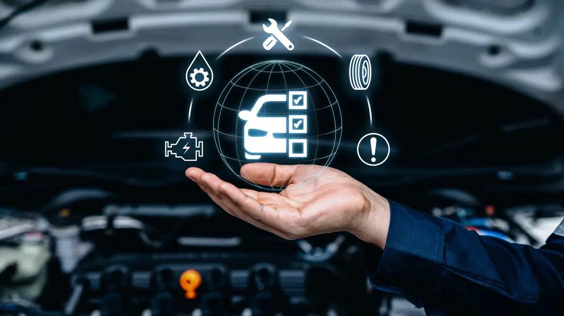 Vehicle inspection icons over an open car engine