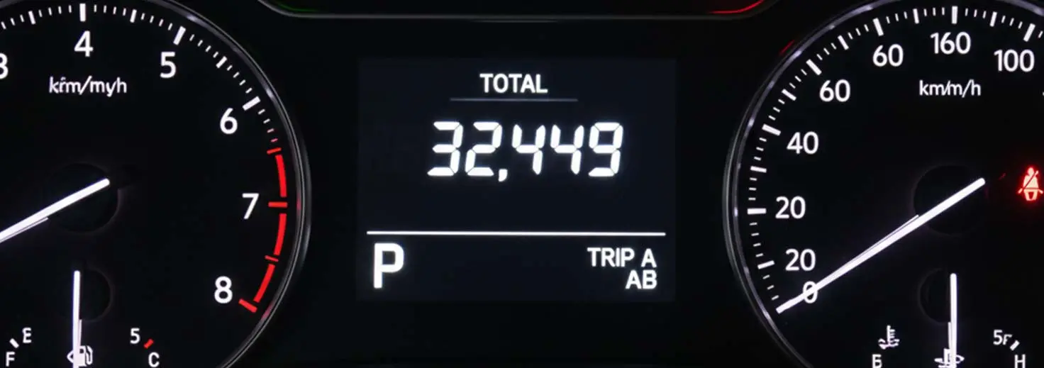Odometer of car reading 32,449 miles