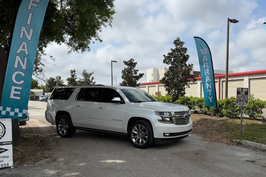 BLVD Auto Inc dealership white suv parked in lot in Bradenton, FL