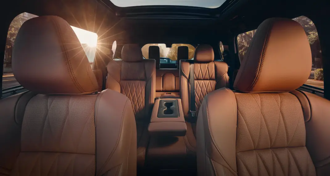 Mitsubishi SUV interior with leather seats and panoramic roof.
