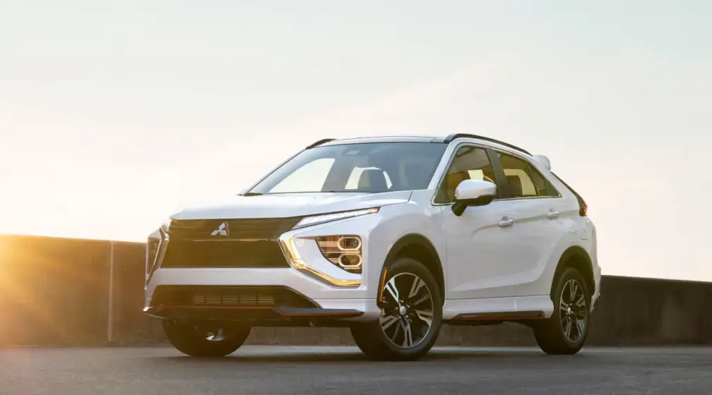 White Mitsubishi Eclipse Cross parked outdoors at sunset for Bob Mills Mitsubishi in Myrtle Beach, SC.