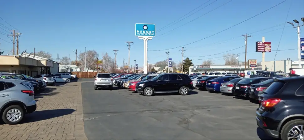 Budget Motors dealership lot with used vehicles for sale in Reno