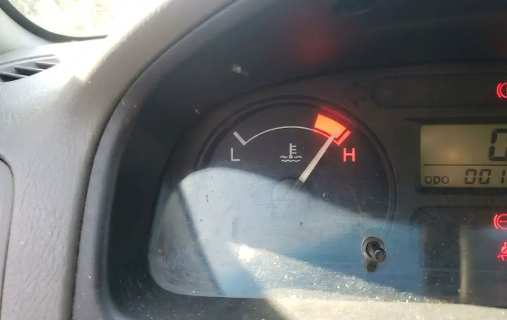 Dashboard temperature gauge showing engine overheating